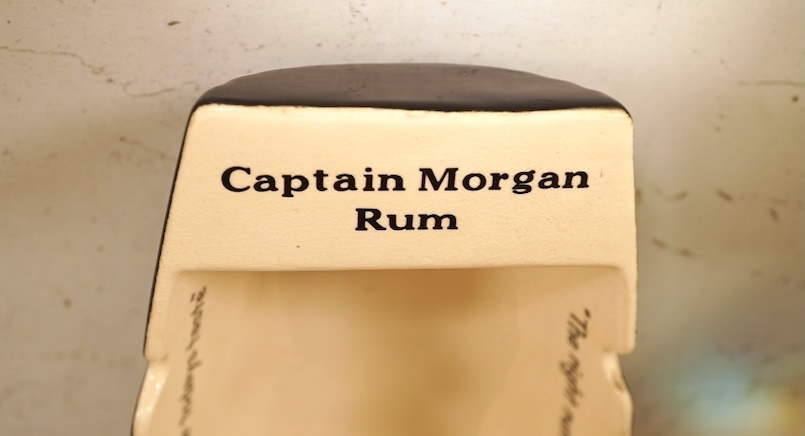 Wade 'Purser's Navy Rum Decanter' and two Captain Morgan rum boat ashtrays, decanter 24cm high